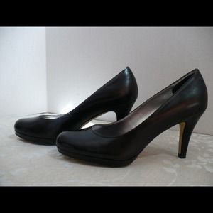 Black leather high heel shoes.