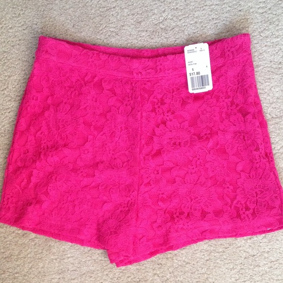 High waisted, hot pink shorts.