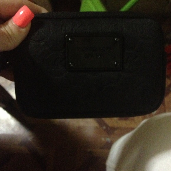 Authentic Michael Kors black wristlet.