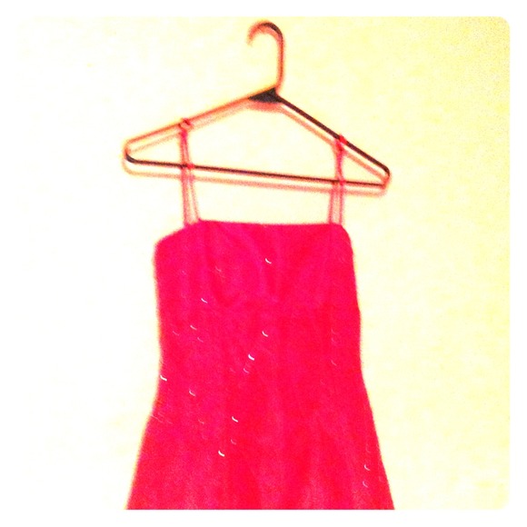 A pink long dress with jewels and 1 strap in back. - Picture 1 of 2