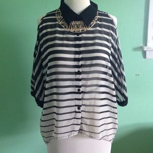 Striped blouse with cutout shoulder detail.