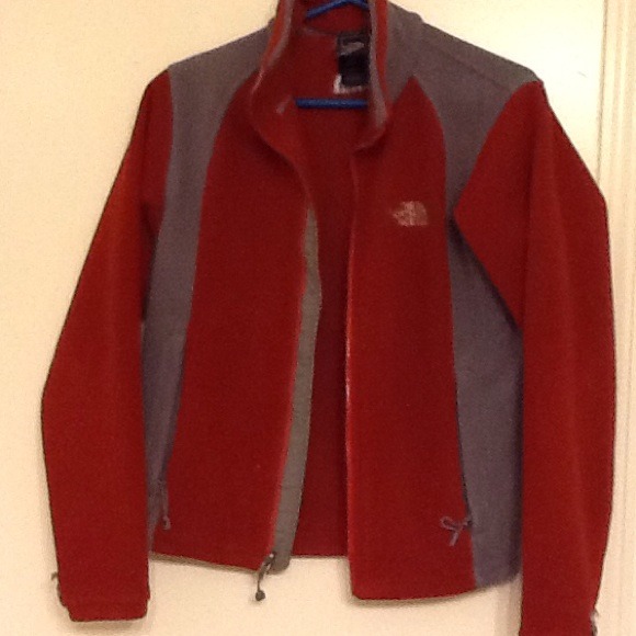 North face jacket red and grey .
