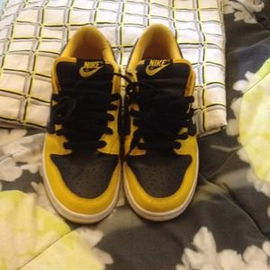 Yellow and black nike sneakers