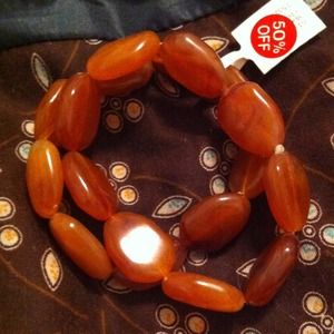 Light orange plastic beaded stretch bracelets