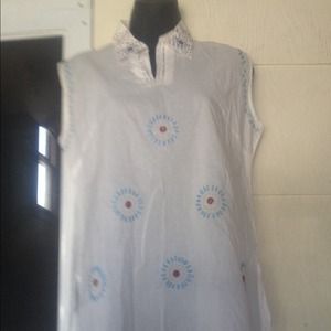 White top with embroidery embellishments.
