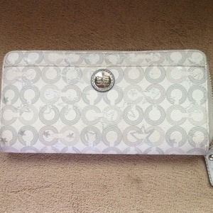 White and silver Coach wallet.