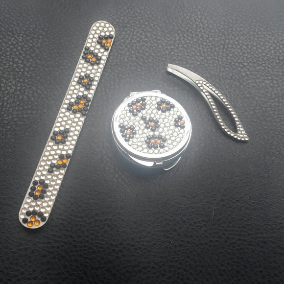 Compact mirror, nail file and tweezers