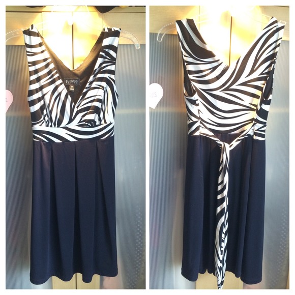 DRESS STRETCHES AND FITS NICELY FROM SIZES 4 - 14!