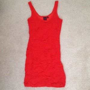 Bright orange/reddish mini dress.