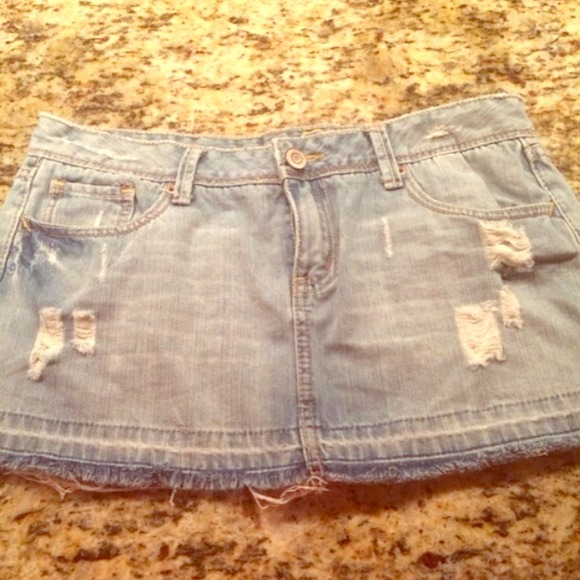 Light wash destructed denim mini skirt fringe