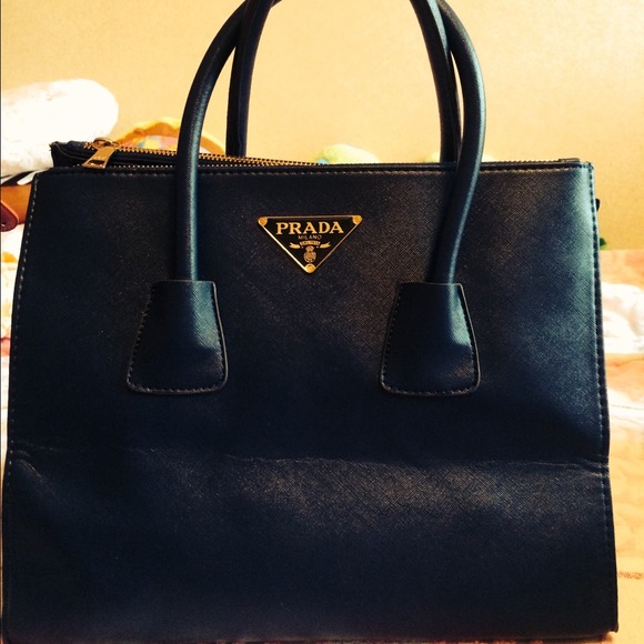 Blu, square ,used bag with the sign PRADA.
