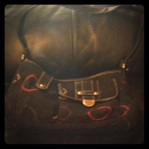 Small black purse with designs