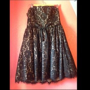 Nude colored party dress with black lace overlay