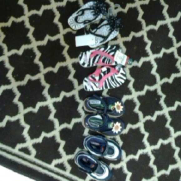 Three baby girl shoes one baby boy shoes