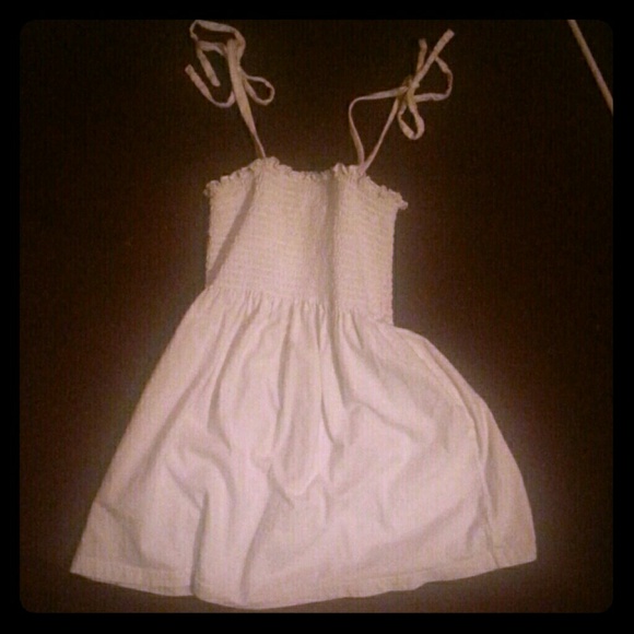 White sceptic tie strap shirt.