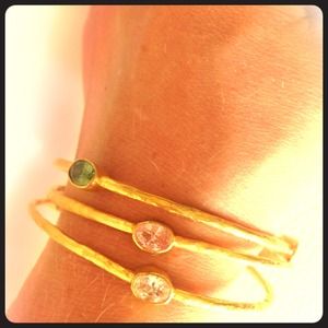 Gold bangle bracelets with colored gemstones