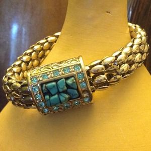 Stunning Bracelet with turquoise little stones; magnetic closure.