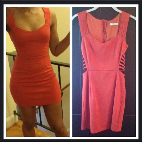 Orange cut out dress.