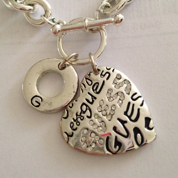 Silver guess necklace