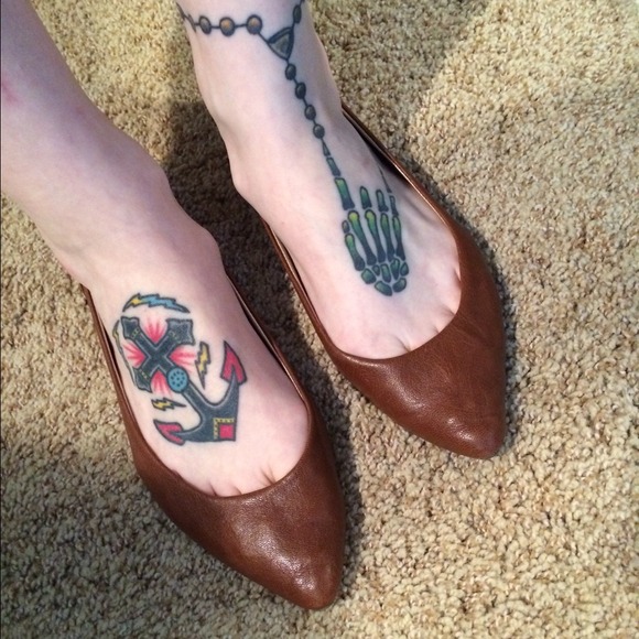 Brown pointy toe flats with gold tiny spikes.