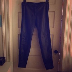 Black leather pants, elastic. Not real leather.