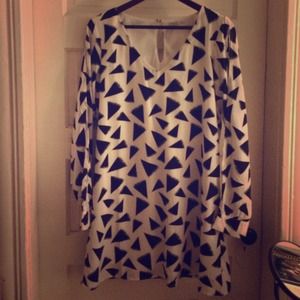 Trendy shift black triangle w/ cut out sleeves.