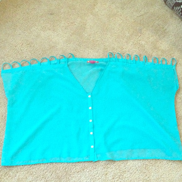 Light blue bathing suit pull over top.