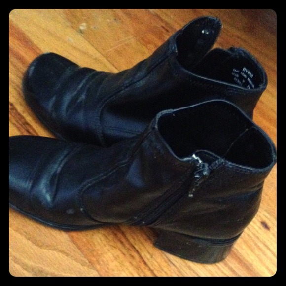 Black leather zip up boots.