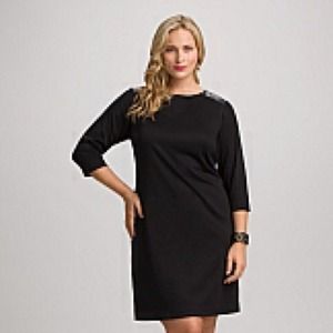 Black party dress with faux leather shoulders.