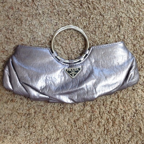 ⬇️Metallic Silver Clutch with "PRADA" logo only