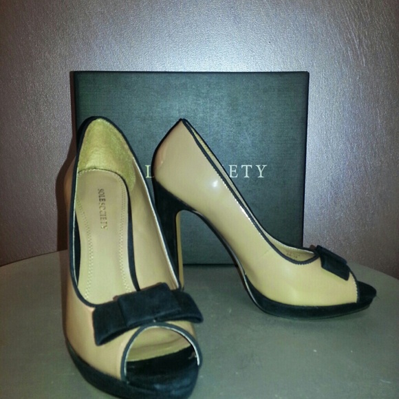 Nude pleather with  black suede bow accent pumps