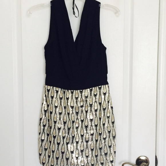 Black and gold sequined dress