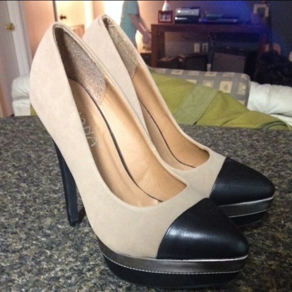 Beige and black pumps