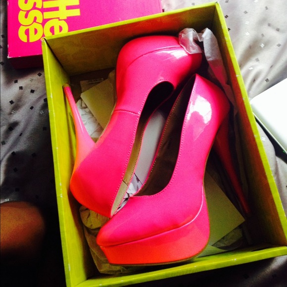 neon / hot pink heels .