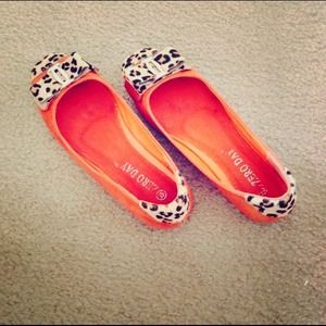 Orange with leopard print flats.