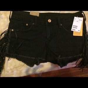 Black H&M shorts with fringes on the side.