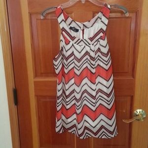 Medium black and orange top, can wear as large