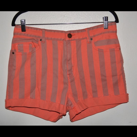 High rise, orange and light grey BDG jean shorts.