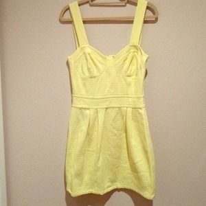 Cute yellow mini summer dress with bustier details