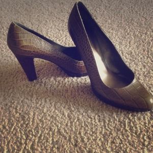 Snakeskin platform pumps