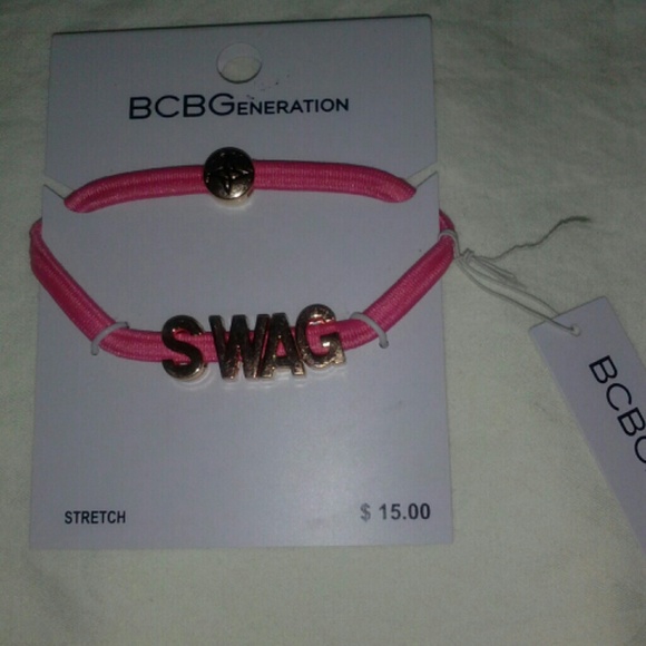 BCBG MAXAZRIA PINK and gold tone swag bracelet