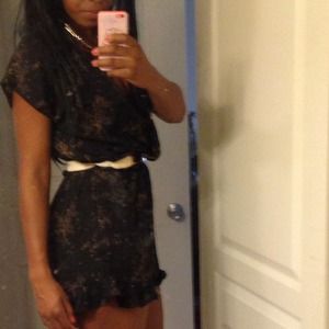 Brand NWT black floral Romper. Deep neckline.