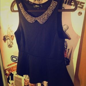 I am selling a black peplum top.