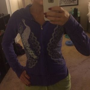 Purple zip up with peacock design.