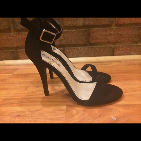 Single strap black heels