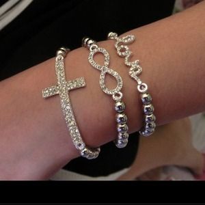 Set of 3 gold accent bracelets.