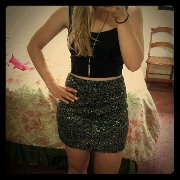 Black and taupe colored mini skirt