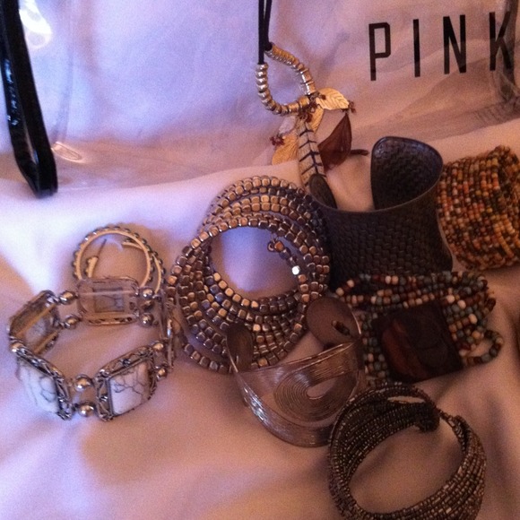 10 brac.,2 prs earr., 2 neck., 1 ring, pink bag