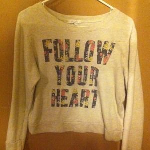 A cute white sweater with floral print