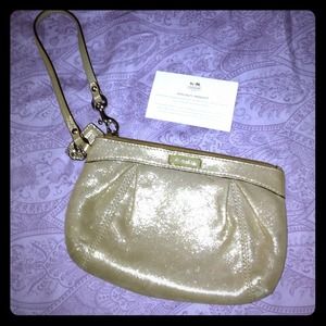 Gold shimmer Coach wristlet